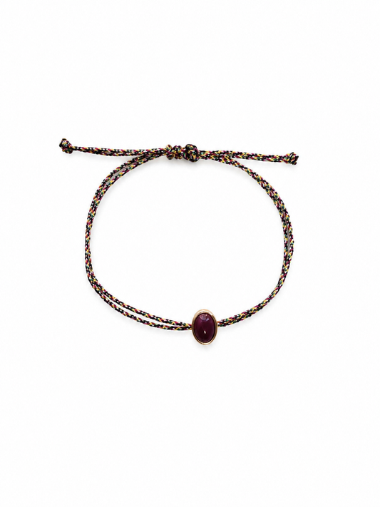 Silk thread bracelet with oval ruby cabochon
