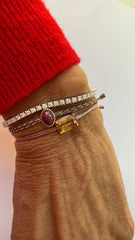 Silk thread bracelet with oval ruby cabochon